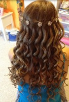 Beautiful prom hairstyle with curls and pink crystal floral hairclips