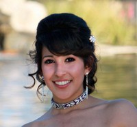 Fancy prom hairstyle with curls and side bang with crystal hairclip