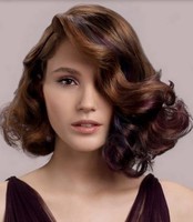 Medium short prom hairstyle with curls and highlights with three tones.