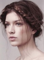 Messy sexy prom hairstyle with braid wrapped around the head looking so romatic