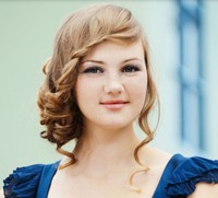 Modern prom hairstyle with cute French braided bang and curly hair