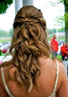 Prom hair with curls and braids and straight hair in the front