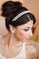 Simple prom updo with pearl headband with swept side bangs