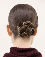 Sleek braided bun with sliver jewelry